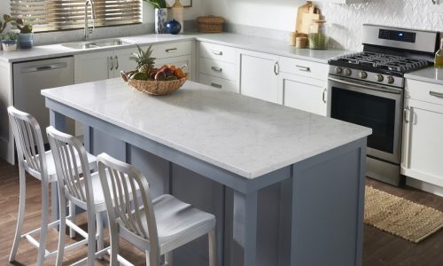 Quartz topped kitchen island with three stools