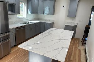 Kitchen with marble topped kitchen island