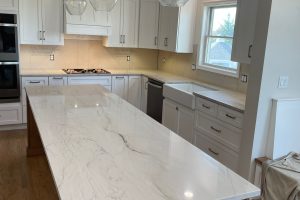 Kitchen with marble topped kitchen island